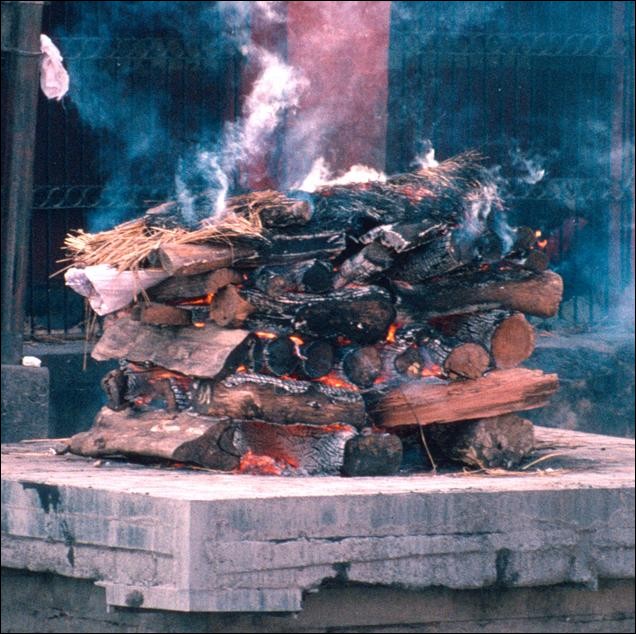 Burning body on the ghats at Pashuputinath near Kathmandu, Nepal