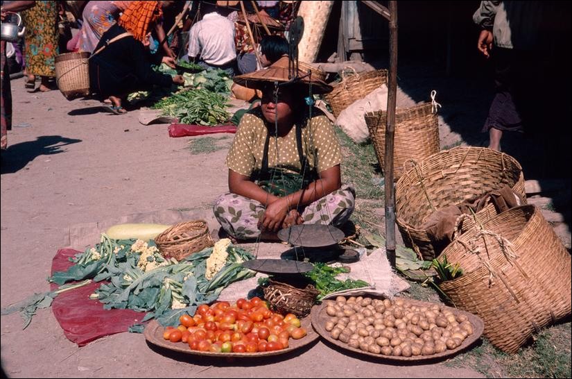 Woman selling vegetables at the market, Inle Lake, Myanmar