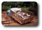 Truck stuck in mud on road from Nam Tha to Huai Xai, Laos