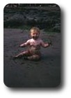 Me eating sand on Pwllgwaelod beach, Wales