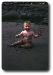 Me eating sand on Pwllgwaelod beach, Wales
