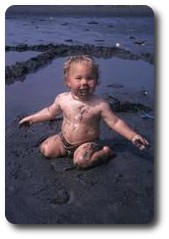 Jon eating sand on Pwllgwaelod beach, Wales