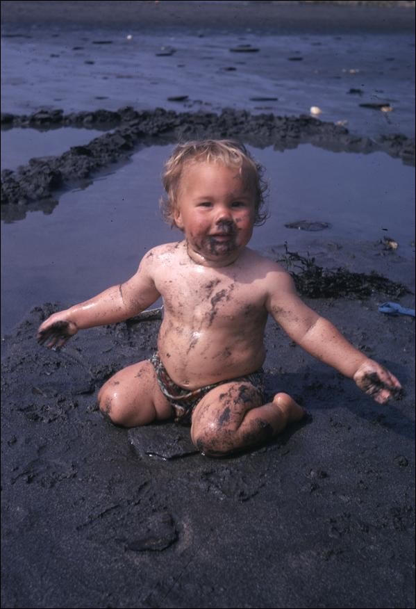 Jon eating sand on Pwllgwaelod beach, Wales